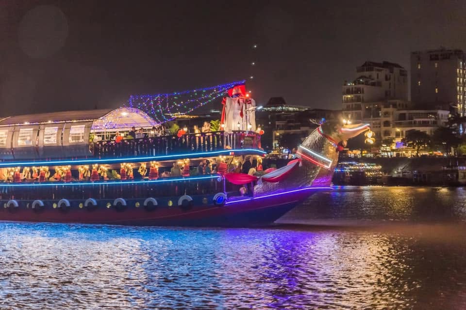 Our dragon boat cruising the Mekong by night